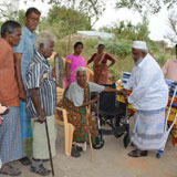 Wheel chair distrubution to crippled, aged leprosy women