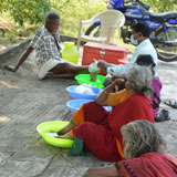 Mobile ulcer care-Soaking of legs with ulcer in medicine water & dressing of leprosy ulcer in camp